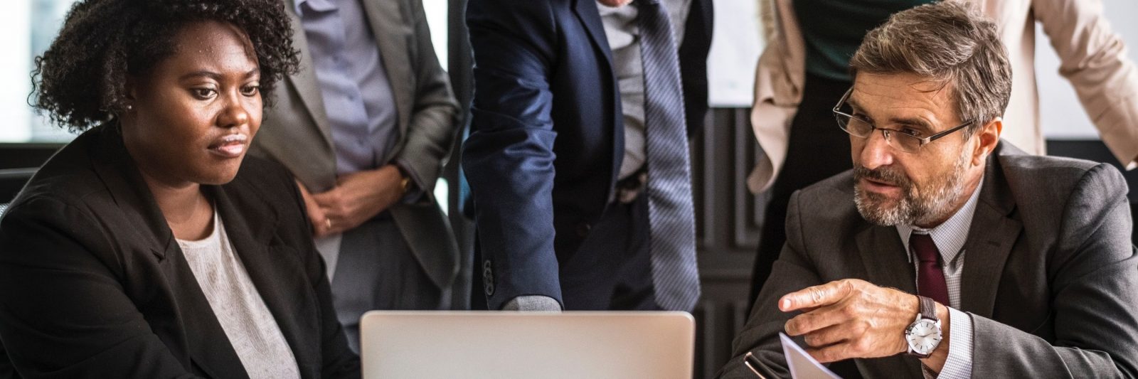 photo of lawyers collaborating; Mai Law Pro Theme, a Wordpress law theme