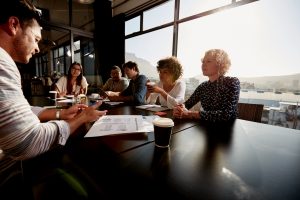 Image of group in training setting – Enhance Neurofeeback offers mentoring and training